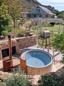 Hot tub with accommodation in background